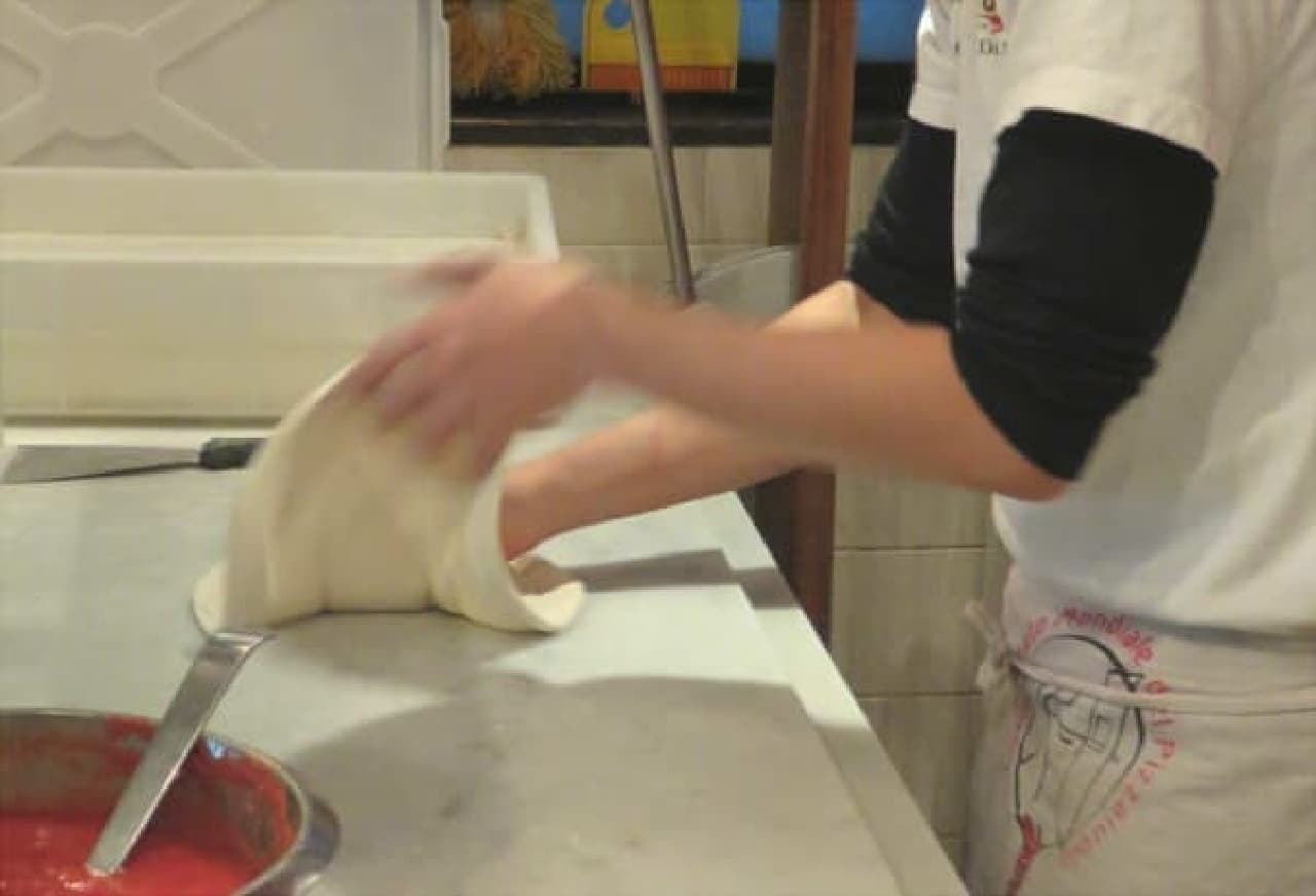 After receiving the order, the dough is stretched and