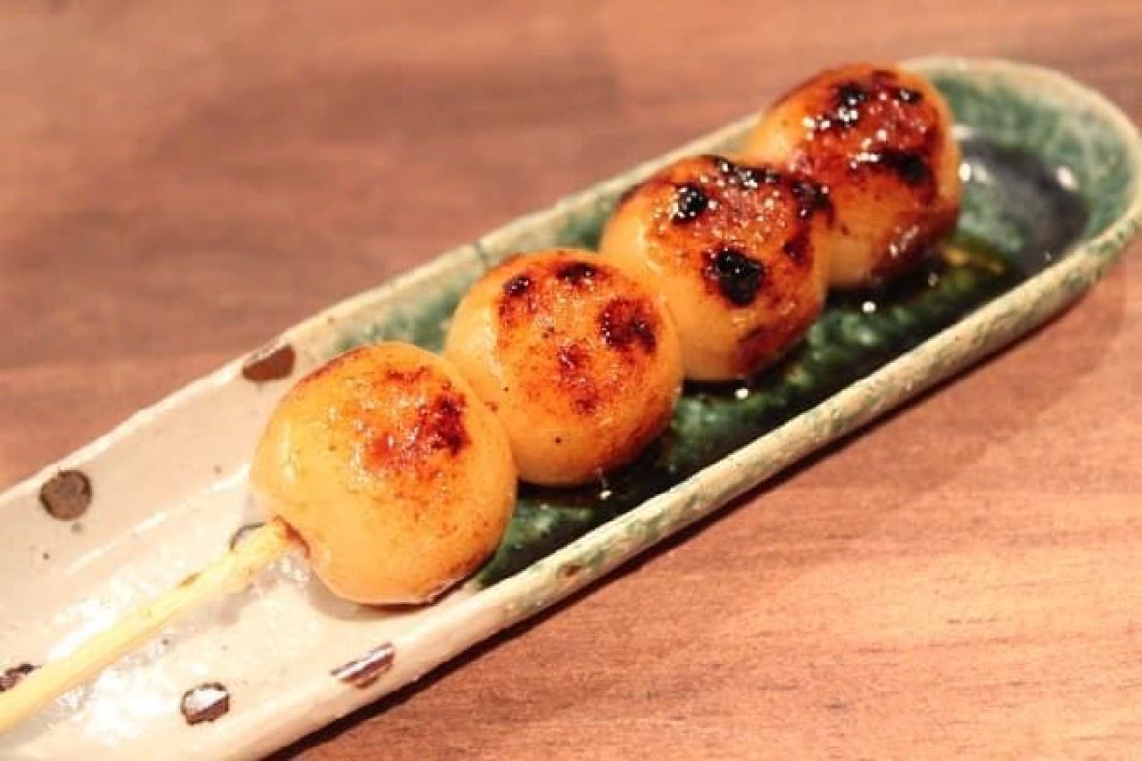 Soy sauce dumplings baked on the same roasting table as yakitori