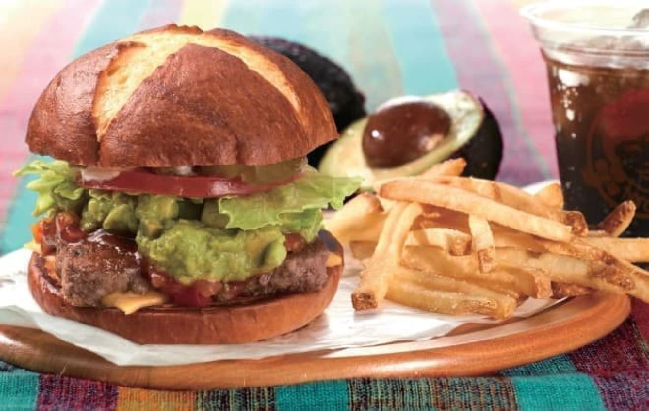 The photo shows the new menu "Pretzel Avocado Salsa Burger"