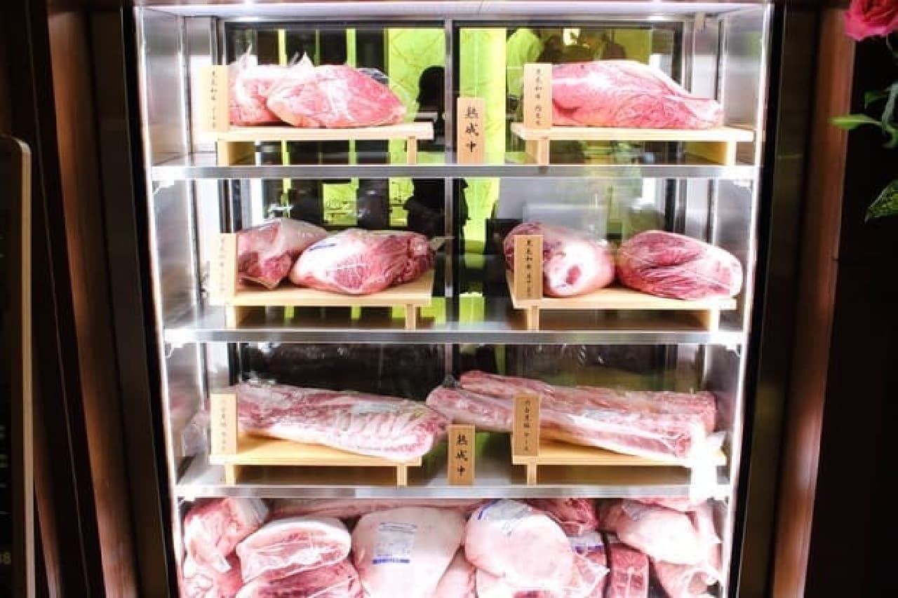 You can see "aging" meat from outside the store