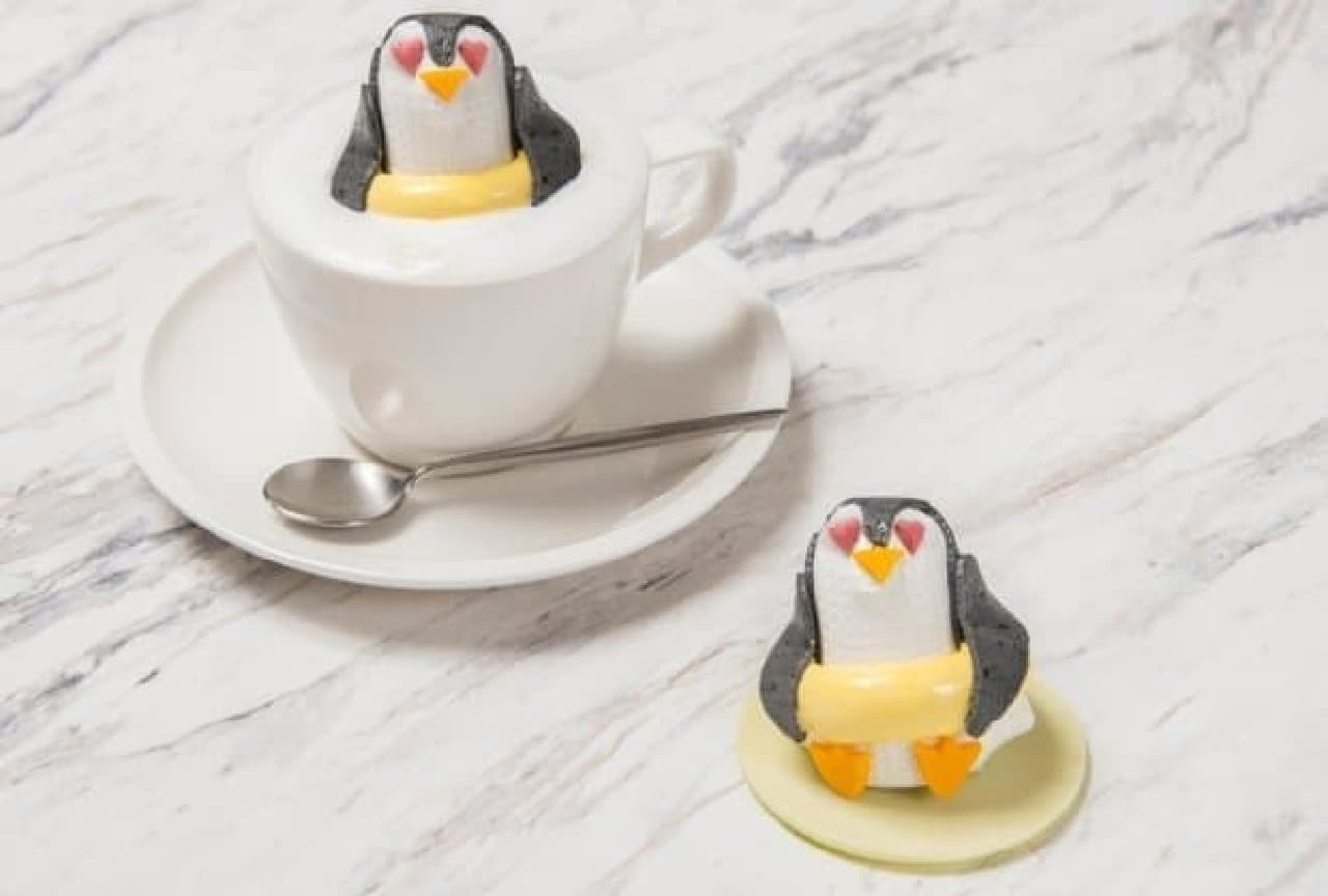 Penguins marshmallows float on cocoa or hot chocolate