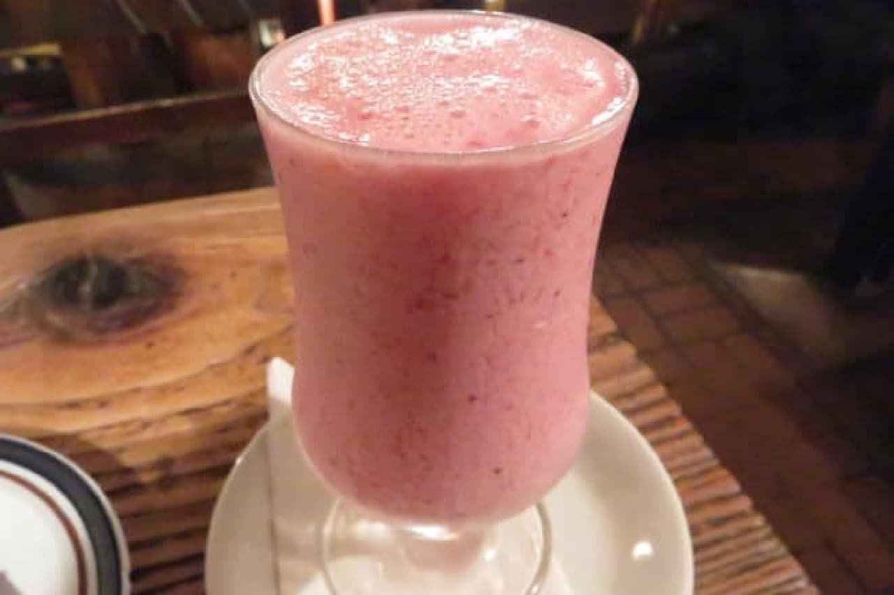 "Strawberry juice" is a drink poured into a tall glass