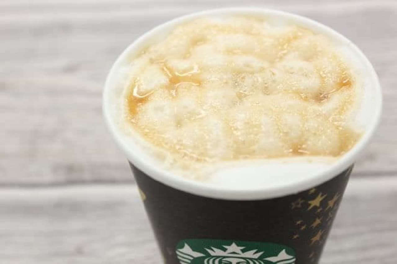 A cup of caramel macchiato syrup changed to caramel syrup