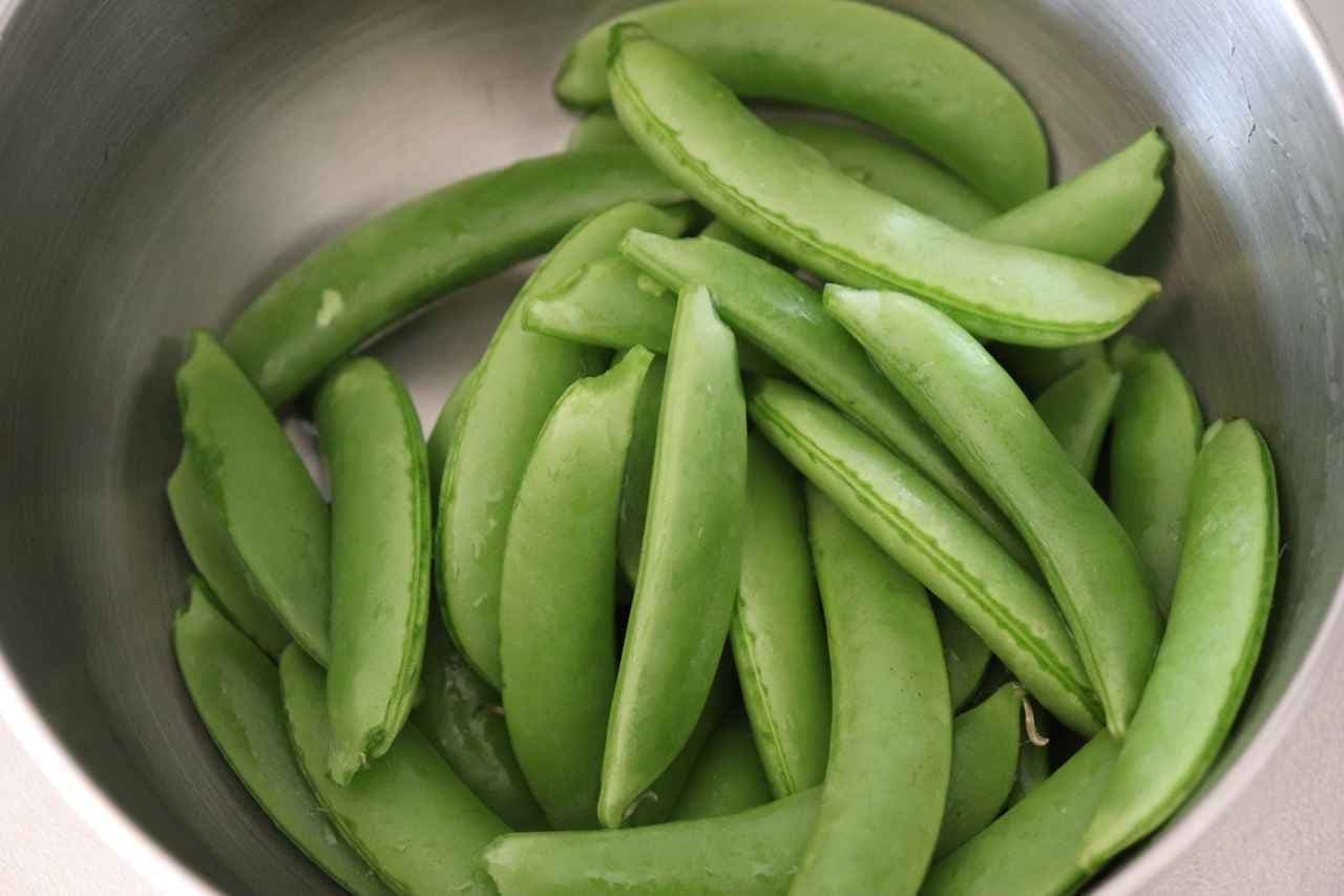 Stir-fried snap peas with consomme butter