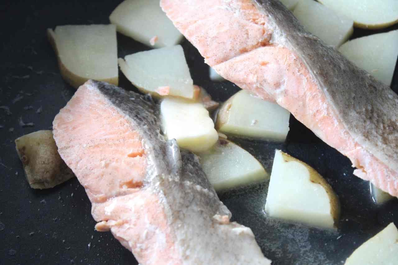 Boiled salmon and potatoes in salt butter