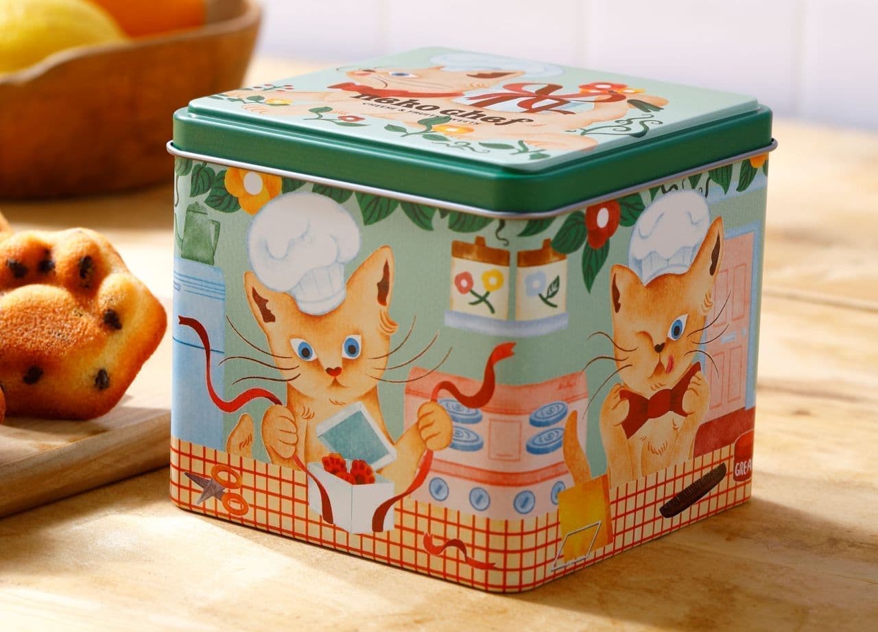 肉球型フィナンシェ2種を楽しめる「ネコシェフ缶　Happy」 絵本のようなストーリー性のあるデザインのパッケージ