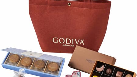 Assorted chocolates and cookies in a felt original limited bag with the Godiva "2021 Autumn Happy Bag" logo!