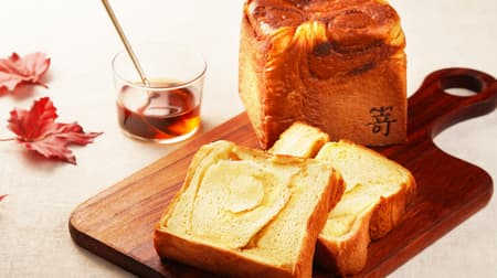 Newly baked brioche bread with dark maple syrup from Quebec, Canada.