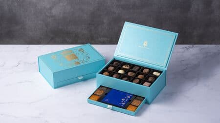 Godiva "Premium Royal Collection" package featuring the image of the Belgian royal coat of arms, with a chocolate plate made by Yamada Heiando