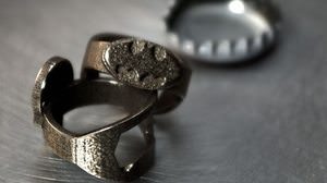 "Batman Ring" is not a free ring! Also as a "bottle opener" to open the lid of a beer bottle