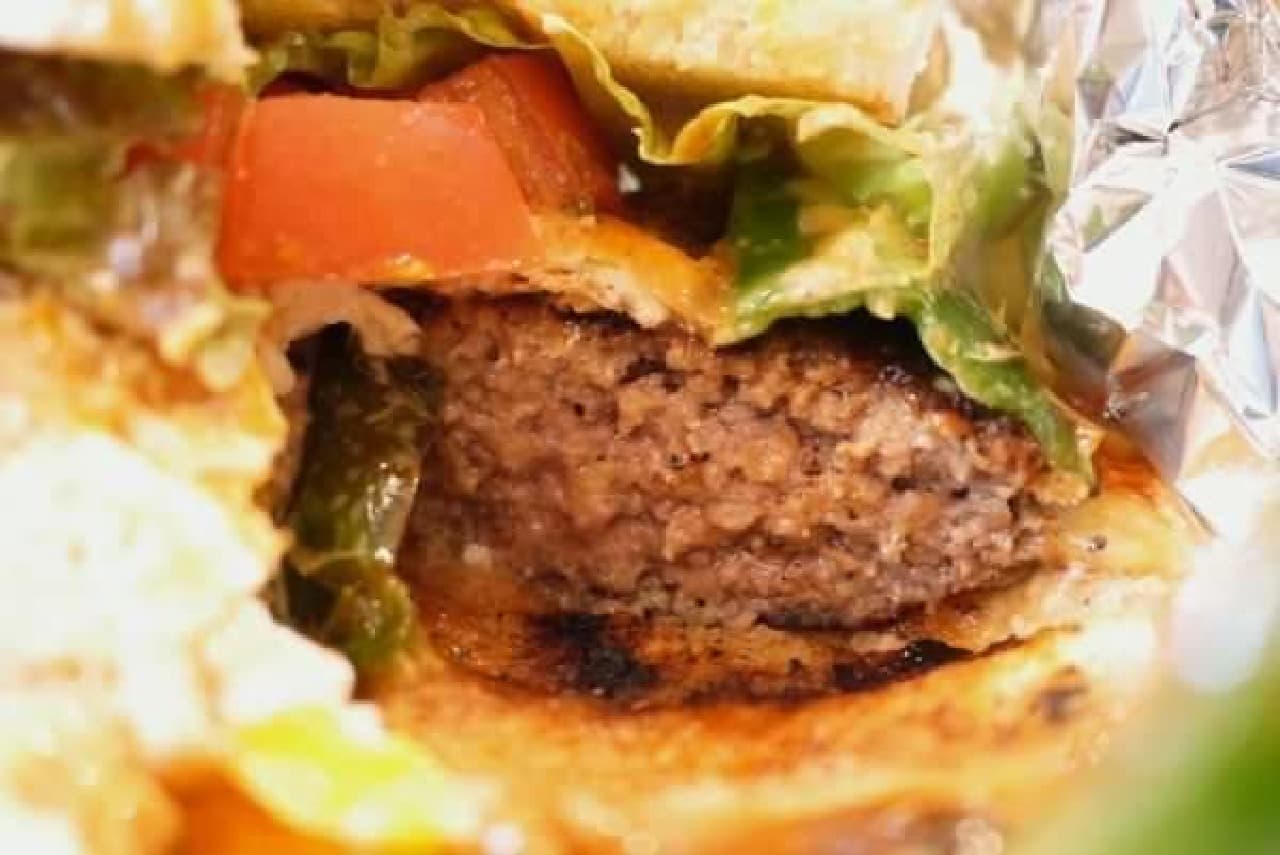 The gravy of this hamburger soaks into the buns.