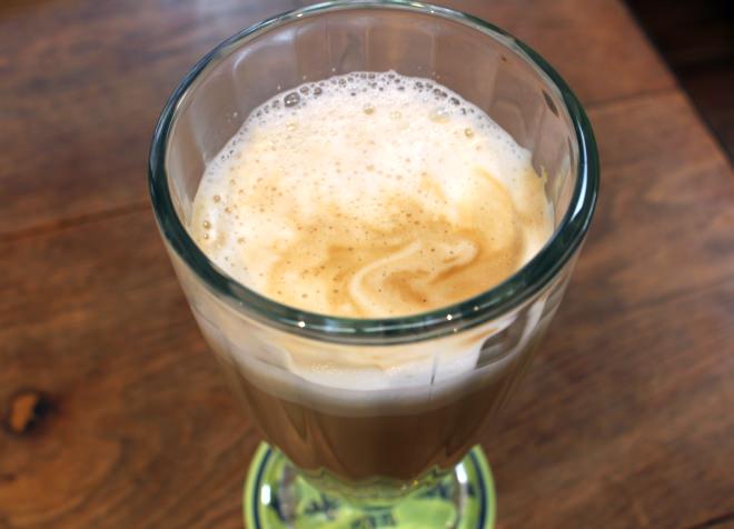 "Cafe con leche" served in tall glass (espresso + steam milk)