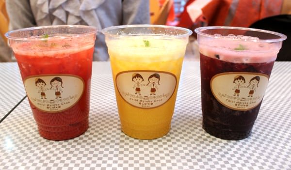 Fresh juice with plenty of pulp (strawberry, orange, blueberry from the left)