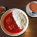 A set of red chicken curry and chai. Fukujinzuke comes with curry