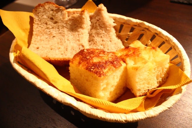 Whole grain bread (back) and cheese-flavored focaccia (front)