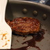 Patty for Teriyaki Burger is entwined with a separate frying pan.